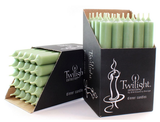 Green candles in black Twilight packaging on a white background