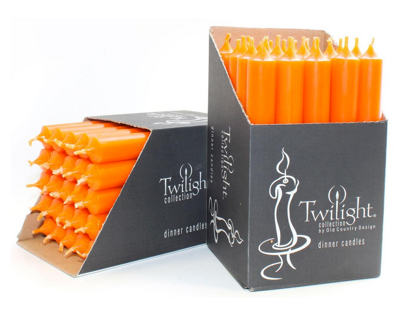 Orange candles in a Twilight collection box on a white background