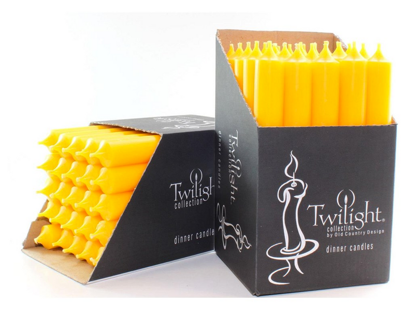 Yellow candles in black 'Twilight' packaging on a white background