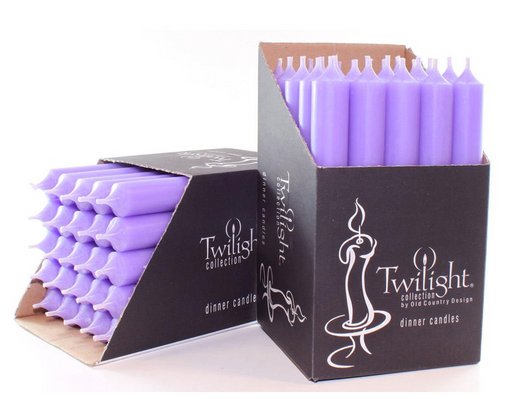 Purple candles in a Twilight collection box on a white background