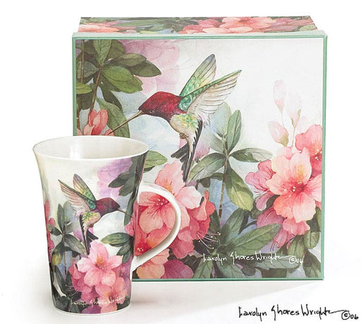 Mug with floral and hummingbird design in front of a matching box