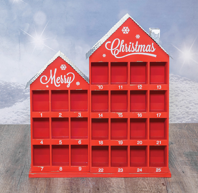 Red house-shaped Advent calendar with 'Merry Christmas' text on a snowy background