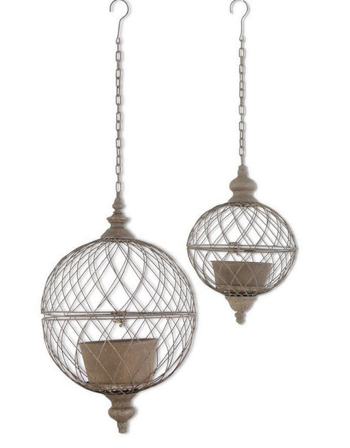 Two decorative hanging metal balls with chains on a white background