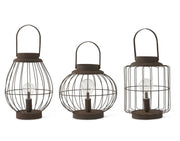 Three metal lanterns with wire cages on a white background