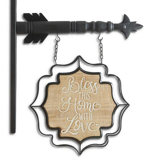 Decorative sign with 'Bless this home with love' text on a white background