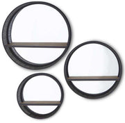 Set of three round wall mirrors with black frames on a white background
