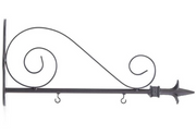 A collection of six different arrow hangers in various colors and materials, including black and white arrows, barnwood, metal scroll, black and cream, and architectural wood holder.