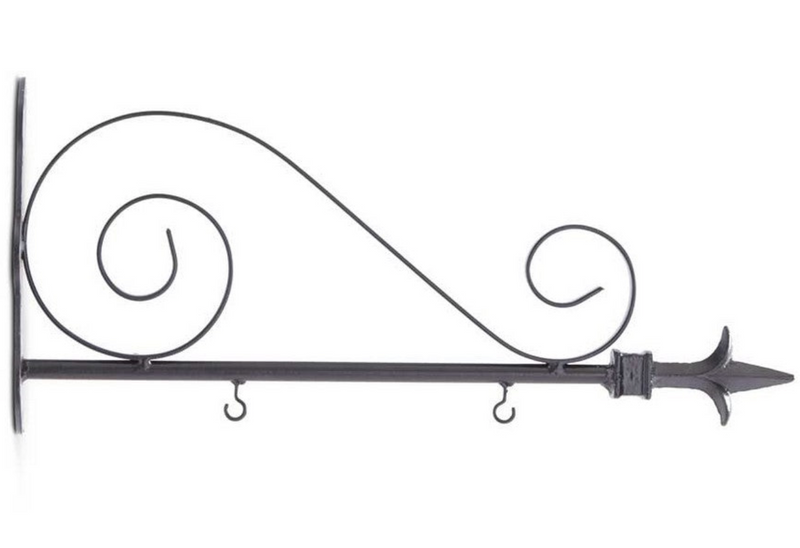 A collection of six different arrow hangers in various colors and materials, including black and white arrows, barnwood, metal scroll, black and cream, and architectural wood holder.