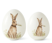 Two decorative eggs with rabbit illustrations on a white background
