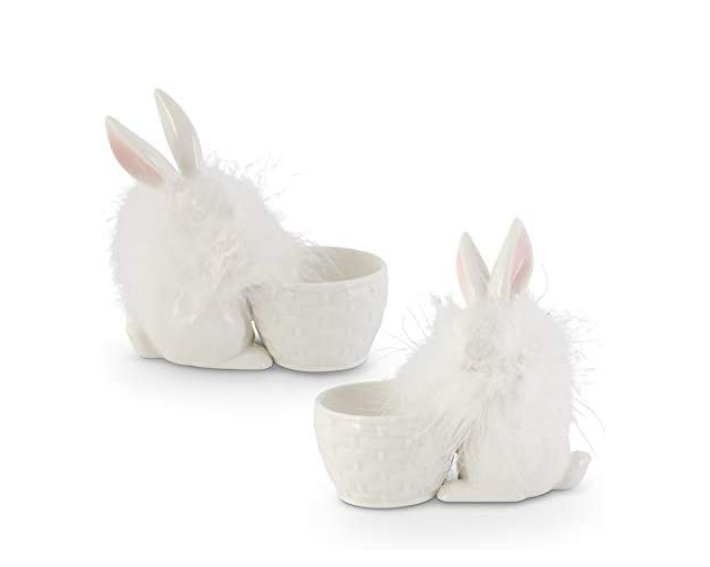 Two white ceramic bunny-shaped planters on a white background