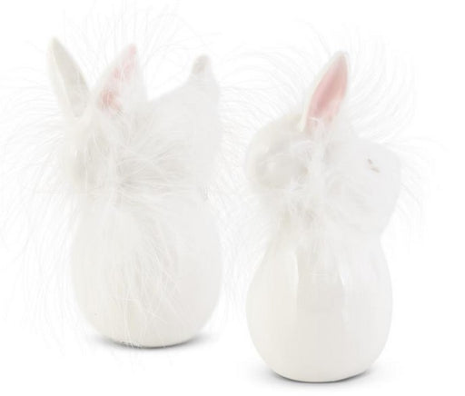 Two white ceramic rabbit-shaped vases on a white background
