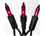 Three red Christmas lights with black connectors on a white background