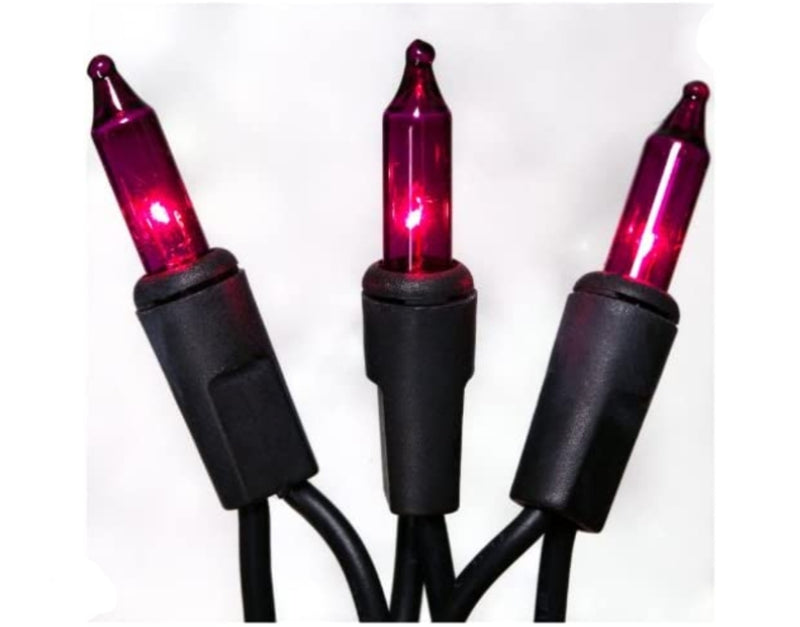 Three red Christmas lights with black connectors on a white background