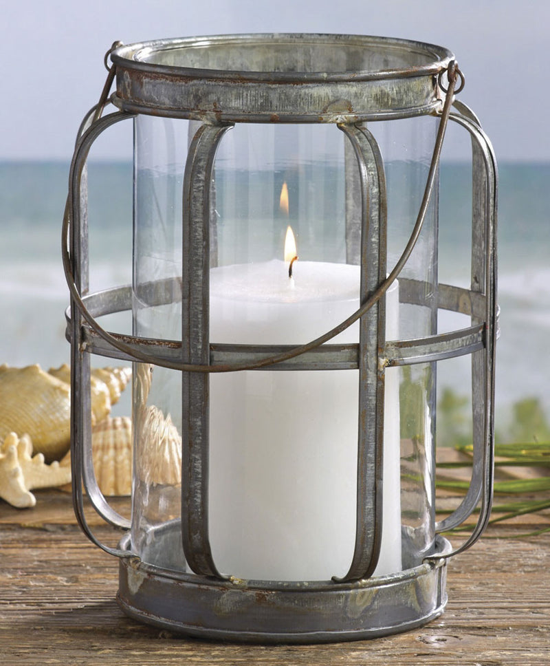 Decorative lantern with a candle on a beach setting