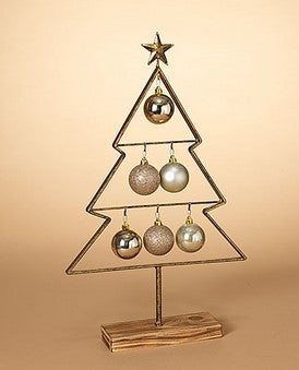 Decorative Christmas tree stand with ornaments on a beige background