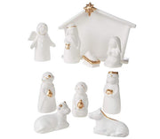 White nativity scene set with gold accents on a white background