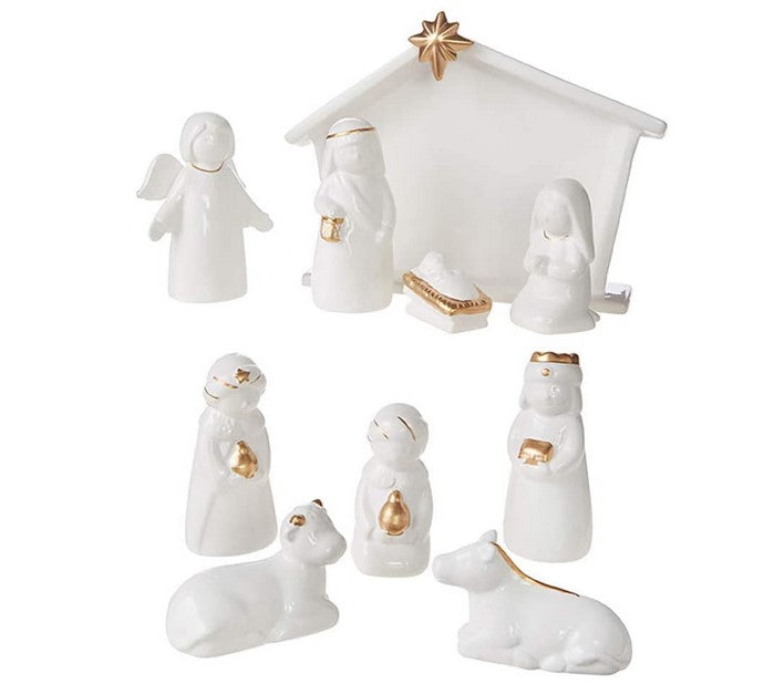 White nativity scene set with gold accents on a white background