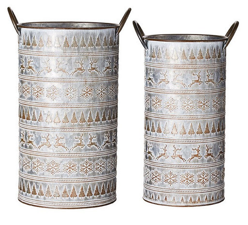 Two cylindrical metal vases with winter-themed patterns on a white background