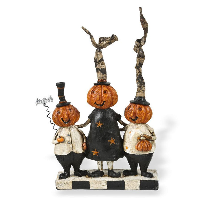 Three pumpkin characters with hats and outfits on a white background