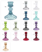 Collection of colorful glass candle holders in various designs on a white background.