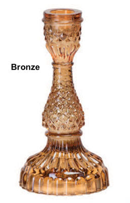 A collection of Bella Candle Holders in various colors. These vintage-inspired glass holders have a pressed and lacquered design, standing 4 inches wide by 8.