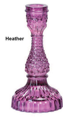 A collection of Bella Candle Holders in various colors. These vintage-inspired glass holders have a pressed and lacquered design, standing 4 inches wide by 8.