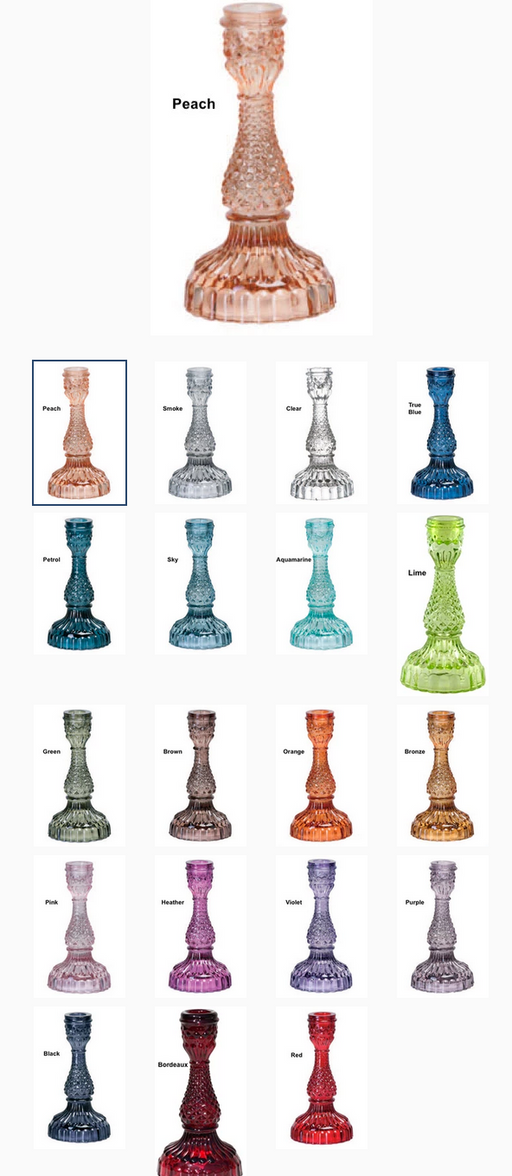 Collection of colorful glass candle holders on a white background