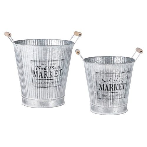 Two metal buckets with 'Fresh Flower Market' labels on a white background