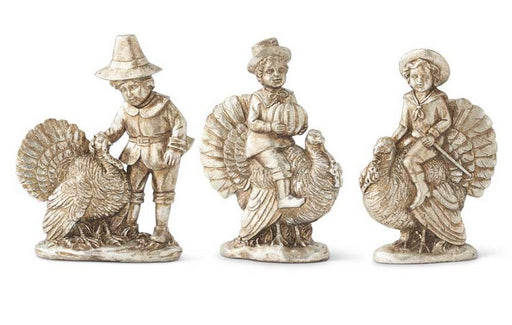 Three decorative figurines of men with turkeys on a white background