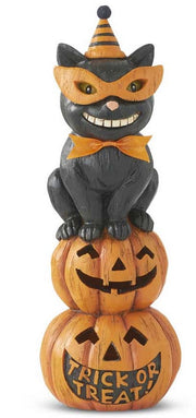 Halloween-themed black cat figurine on stacked pumpkins with 'Trick or Treat' text.