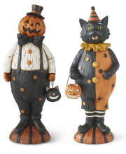 Two Halloween-themed figurines, one resembling a cat and the other a pumpkin, on a white background.