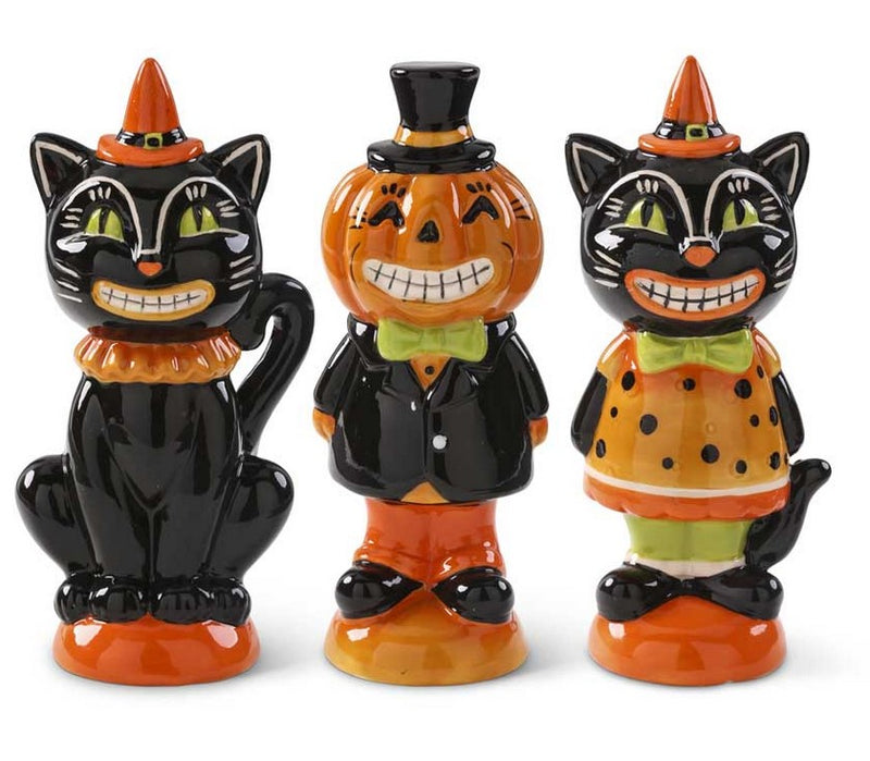 Three Halloween-themed figurines resembling a black cat, pumpkin, and another cat on a white background.