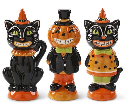 Three Halloween-themed figurines resembling a black cat, pumpkin, and another cat on a white background.