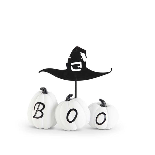 Halloween-themed decorative set with white pumpkins and a black witch hat on a white background