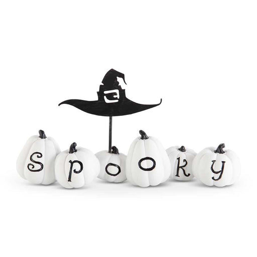Halloween-themed decorative set with white pumpkins spelling 'Spooky' and a black witch hat on a white background.