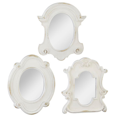Three decorative mirrors with ornate white frames on a white background