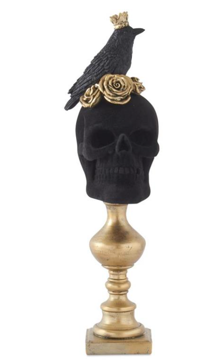Decorative skull with a crow and gold rose on a white background
