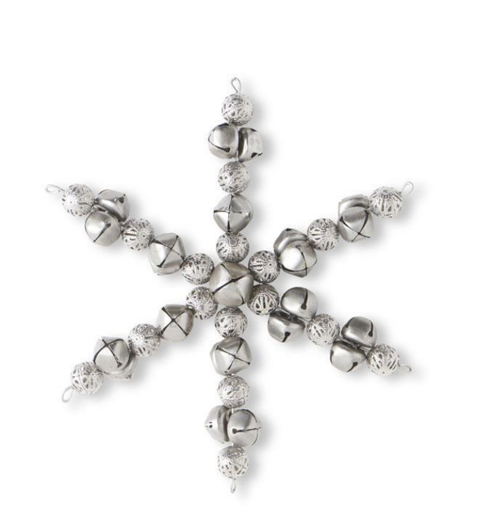 Silver snowflake ornament with clear crystals on a white background