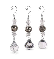 Set of three crystal earrings on a white background
