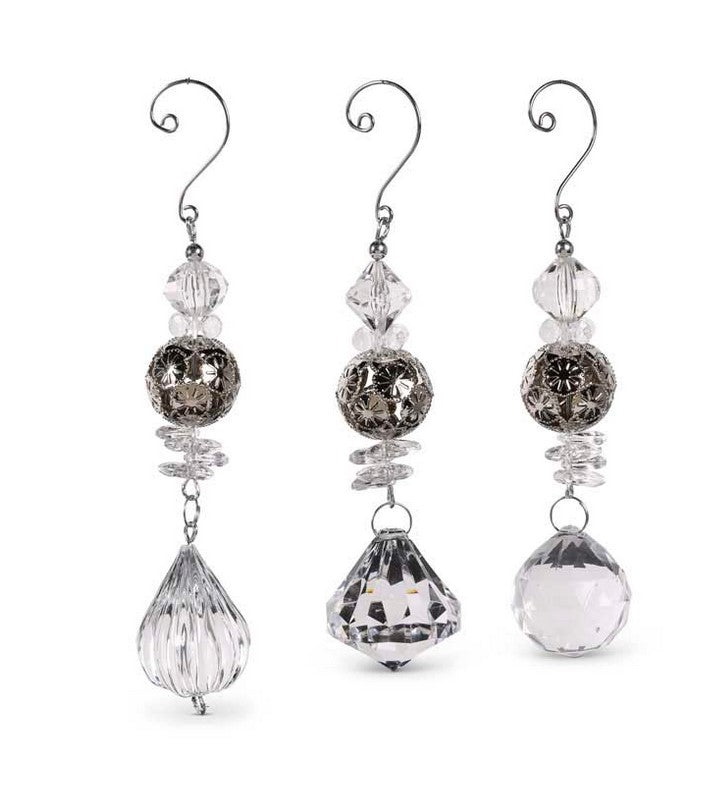 Set of three crystal earrings on a white background