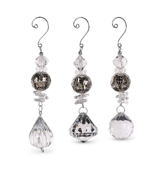Set of three crystal earrings on a white background