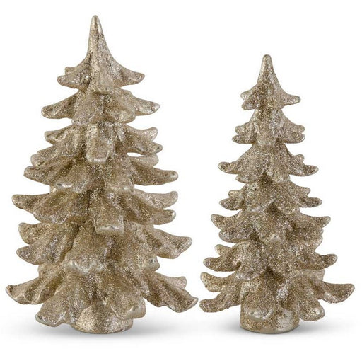 Two glittery Christmas tree figurines on a white background