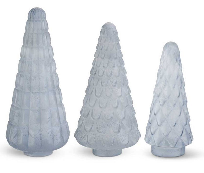 Three textured glass Christmas tree figurines on a white background