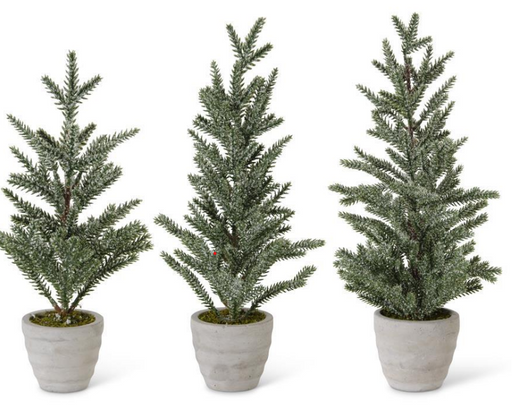 Three potted artificial Christmas trees on a white background