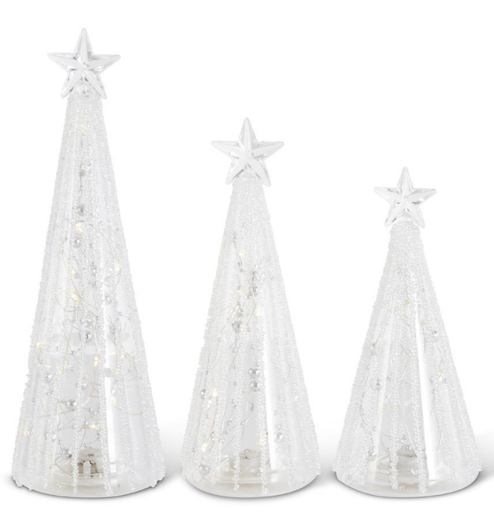Three white Christmas trees with star decorations on a white background