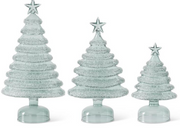 Three decorative Christmas trees with star toppers on a white background