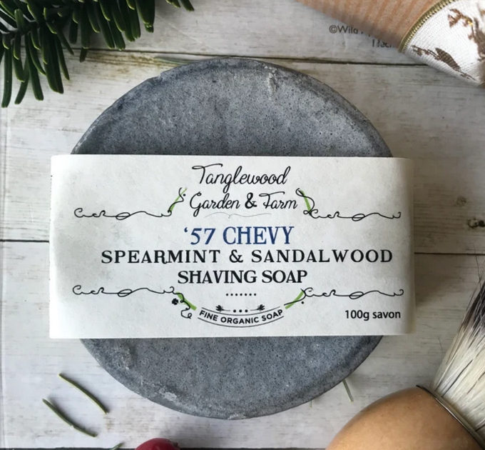 Tanglewood Garden & Farm '57 Chevy Spearmint & Sandalwood Shaving Soap on a wooden surface with a label.