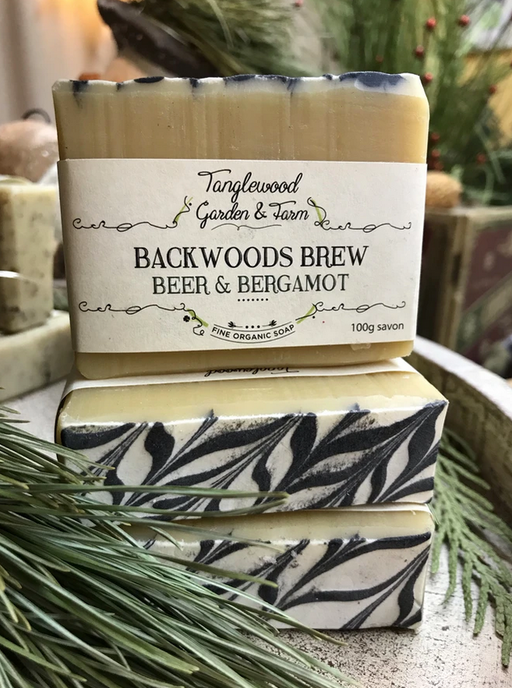 Bar of soap with 'Tanglewood Garden & Farm' branding on a natural background