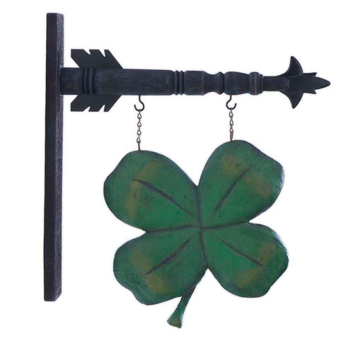 Decorative metal wall art with a four-leaf clover design on a white background
