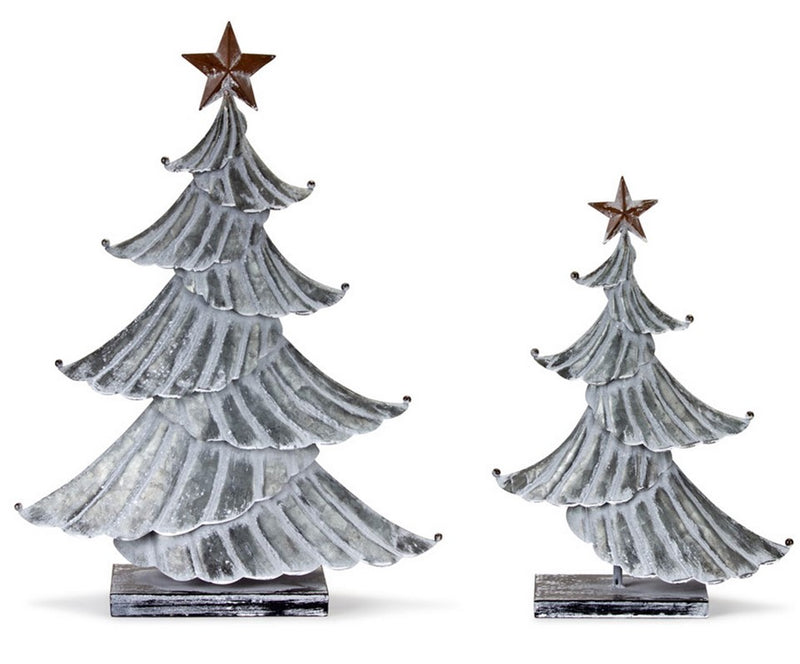 Two metallic Christmas tree decorations with star toppers on a white background